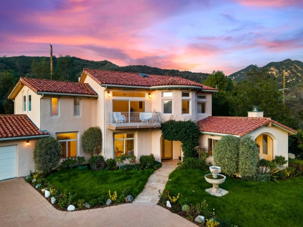2175 Cold Canyon Road Calabasas - Front View of a House property with green grass