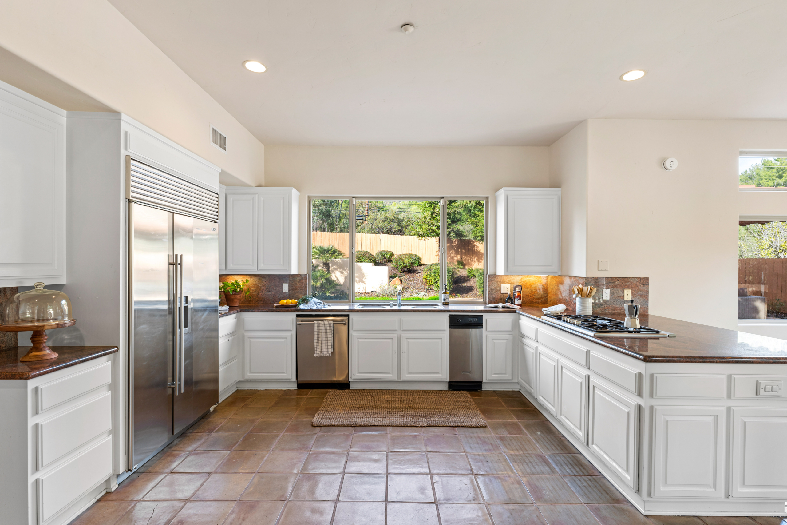 Kitchen view with embedded fridge, kitchen island at 2175 Cold Canyon Road Calabasas