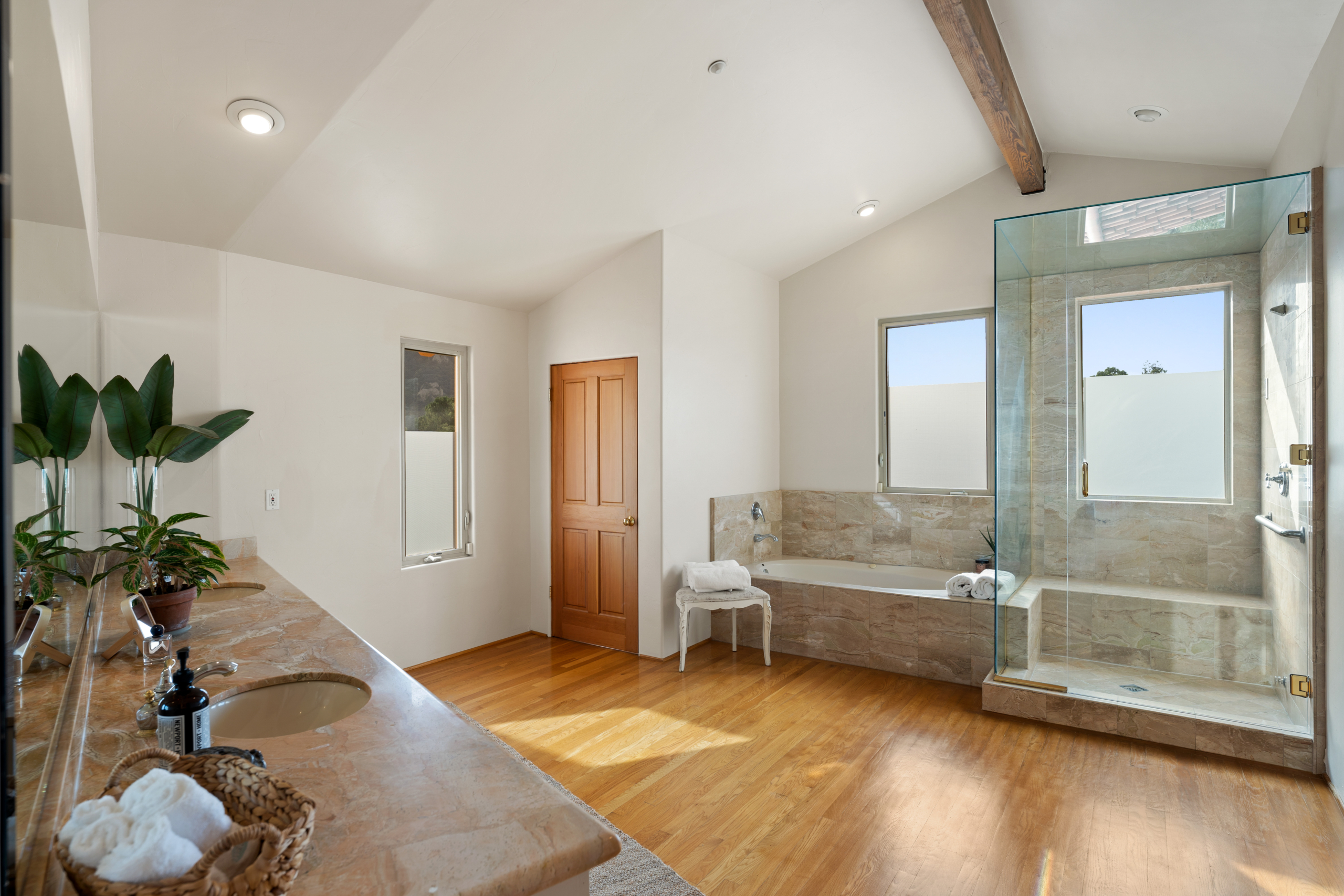 Bathroom with bathtub, shower glass and mirror at 2175 Cold Canyon Road Calabasas